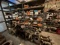 ROW OF 3 SHELVES W/ (6) PILLOW BLOCK RIG SHAFTS, SPROCKETS, UNUSED SEALS & BEARINGS, & RELATED