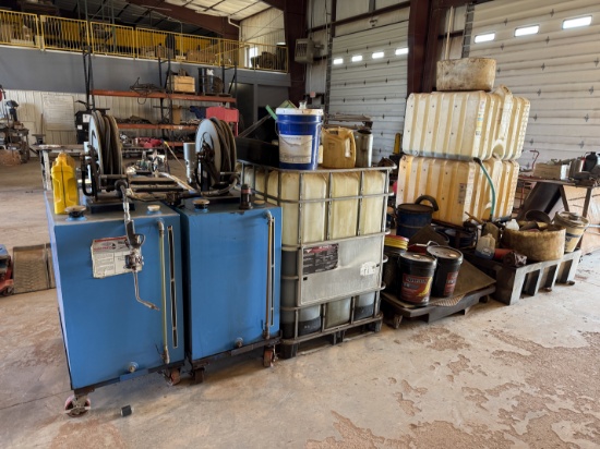 LOT W/ (2) 150-GALLON STEEL ROLLING OIL TANKS W/ AIR PUMPS, GUNS, & HOSES, (HAS SOME FLUID), (3) ROL