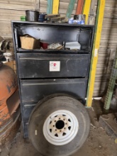 (1) 5- SLIDING DRAWER CABINET W/ CONTENTS & (1) ST235/85R16 TIRE & WHEEL, & SMALL CRATE W/ MISC. TOO