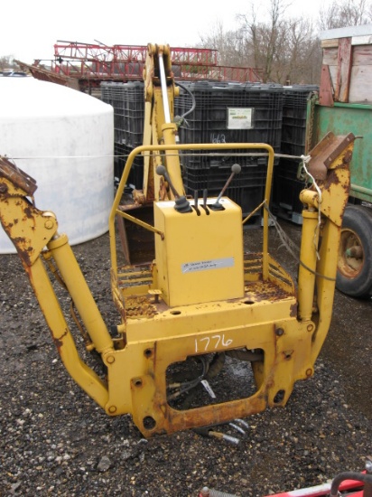 Backhoe off Vermeer Trencher