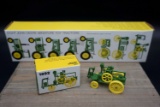 Eight JD Miniature Toy Tractors