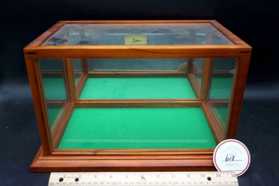 Glass Display case with John Deere logo