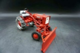 Farmall Cub with plow and tire chains
