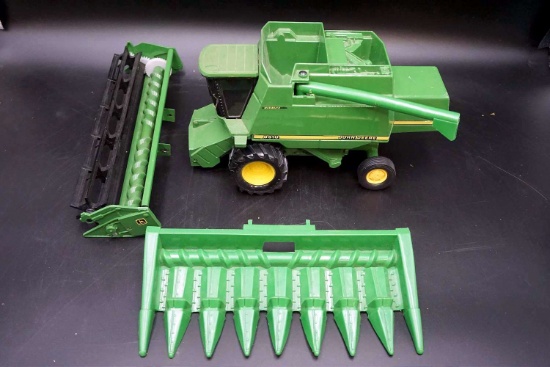 Diecast John Deere 9510 with attachments.