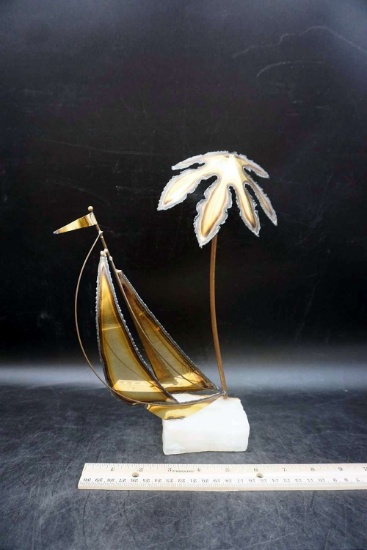 Sailboat and palm tree paperweight.