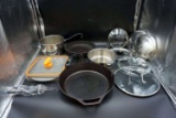 Cast iron, pots, pans, lids.