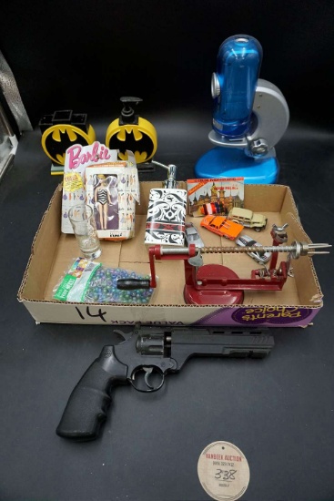Pellet gun, bathroom set with Batman, microscope, Barbie, Apple Peeler.