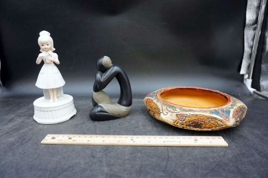 Two figurines come on Native bowl.