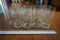 9 matching glass cups.