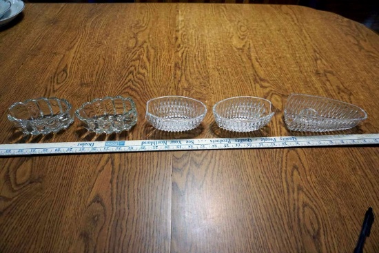 Assorted cut glass silverware rests.