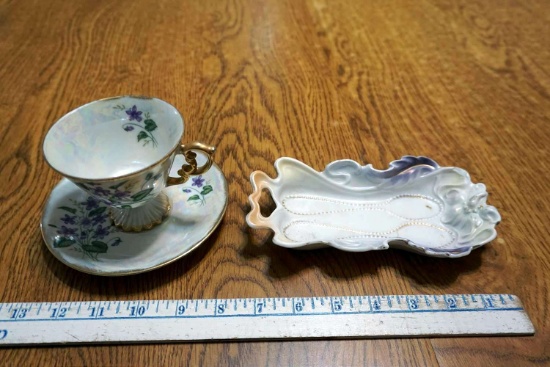 Cup, saucer, spoon rest.