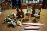 Assorted candle holders and candle sticks.