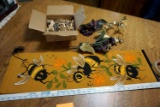 Painted tapestry with Retro 70s vibe, clothespins, brass, butterfly artwork.