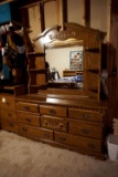 Large dresser with mirror and shelves.