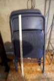 4 blue folding chairs.