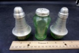 Green depression glass salt and pepper shakers.