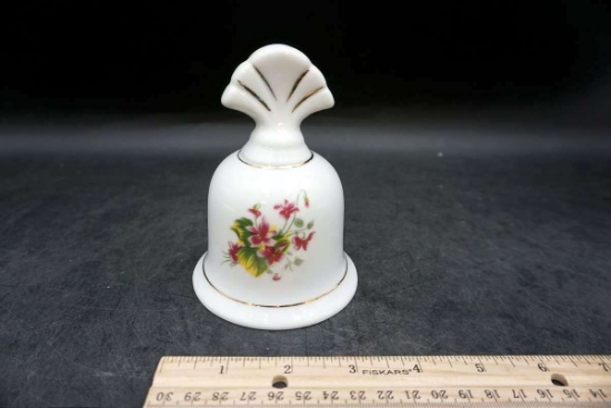 Enesco bell with flower.