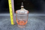 pink depression glass jar with lid.
