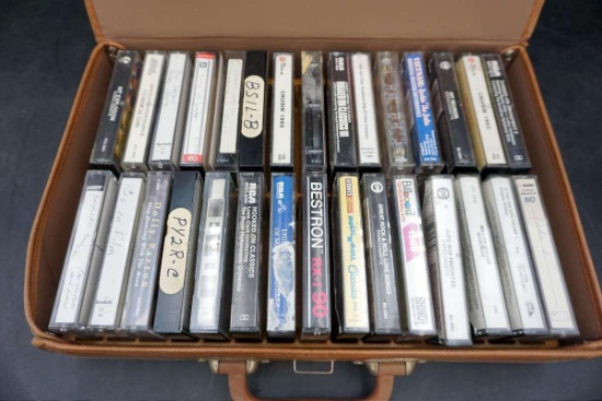 Cassette tape collection in travel case.