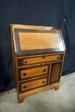 Very unique antique drop front desk. With. Many varying wood tones.