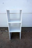 Small white shelf.