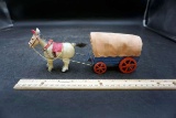 Donkey and covered wagon.