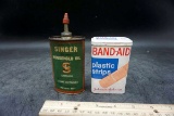 Singer sewing machine oil can. Band aid can.