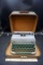Remington typewriter and travel case.