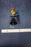 Cast iron bell with chicken.