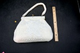 White beaded purse entirely covered. Art deco detailing