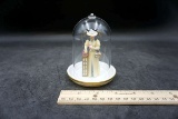 Lady figurine in glass Dome.