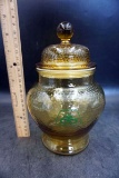 Amber pioneer jar with lid.