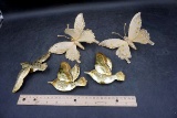 Brass hummingbirds and butterflies.