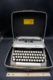 Sterling typewriter in travel case.