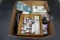 Bell and Howell digital camera, Texas Instruments calculator, cell phones,  model car paint.