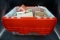 Heavy duty clear tote with red lid. Full of Christmas ornaments.