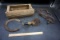 Trap, bits, horseshoe, brush, wooden box.