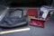 Handbag, binder, glasses, finishing touch hair remover.