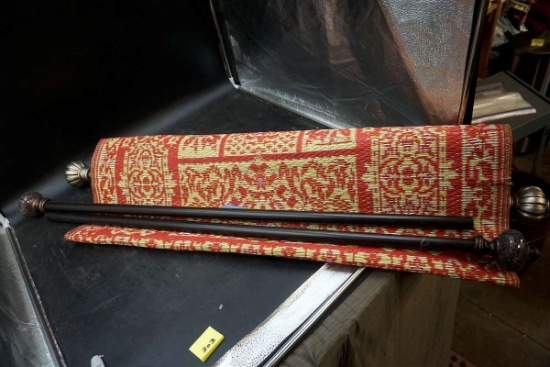 Tapestry with rods.