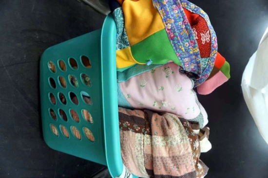 Laundry basket with three handmade blankets. Quilts.