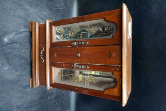 Jewelry box full of costume jewelry.