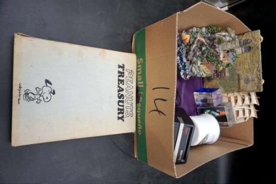 Peanuts treasury book., Polaroid cameras, cameras, lighthouse figures, sailboats, artwork, and more.