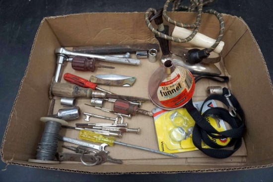 Box of tools, wire, iron, funnel, sockets, ratchet, keys. And more. Pocket knife.
