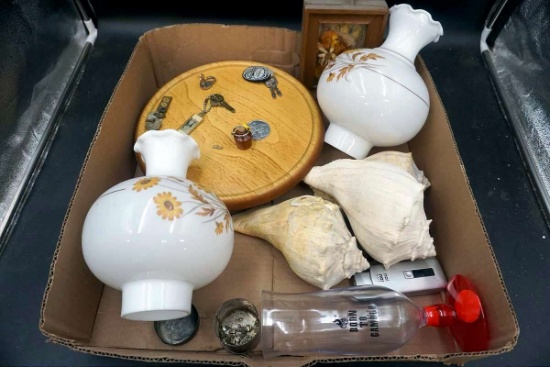 Glass lamp shades, keys, conch shells, art work.
