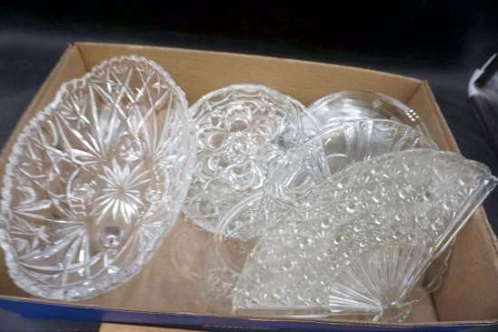 Box full of clear glass dishes.