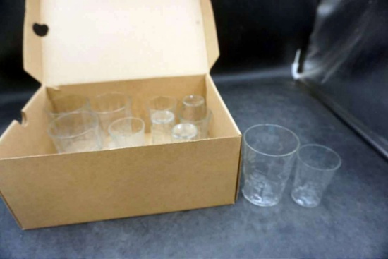 Box full of glassware. Clear glass cups.