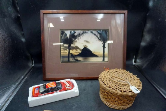 Diecast stock car, basket, artwork.