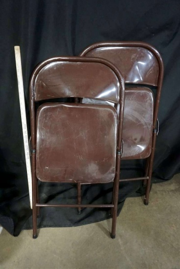 Metal folding chairs.