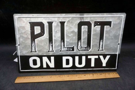 Pilot on duty metal sign.