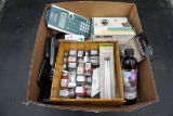Bell and Howell digital camera, Texas Instruments calculator, cell phones,  model car paint.